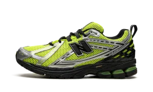 1906R "Volt / Black" running on a dirt path day - visibility shoes