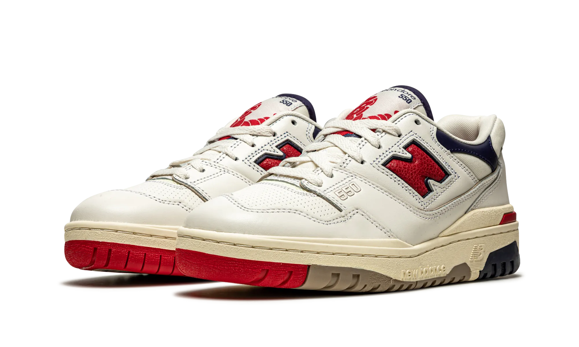550 "Aime Leon Dore - White Navy Red" running in a metal bridge area shoes