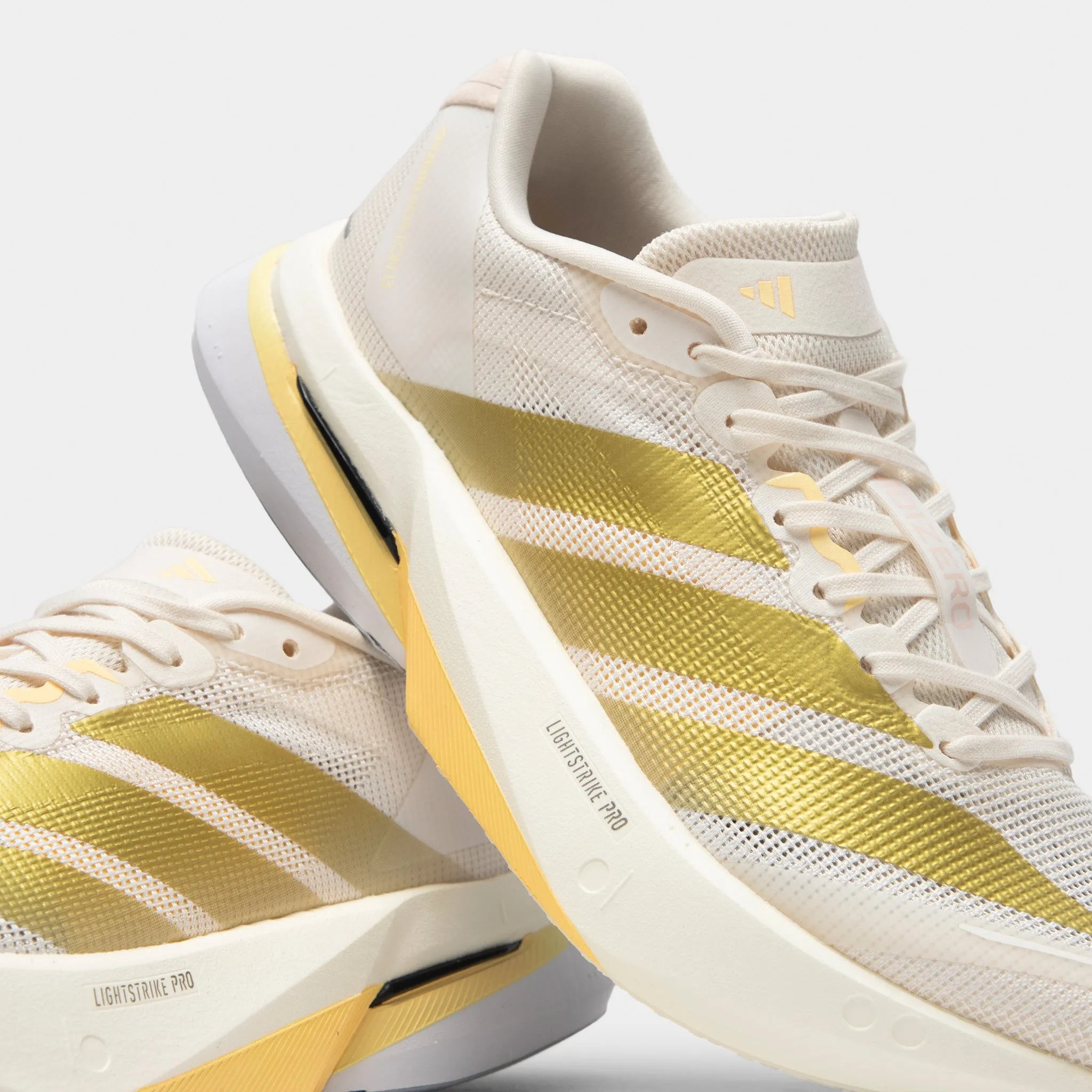 adidas Women's Adizero Boston 13 Chalk White / Gold Metallic - Orange Tint Lasting Comfort Buckle Detail