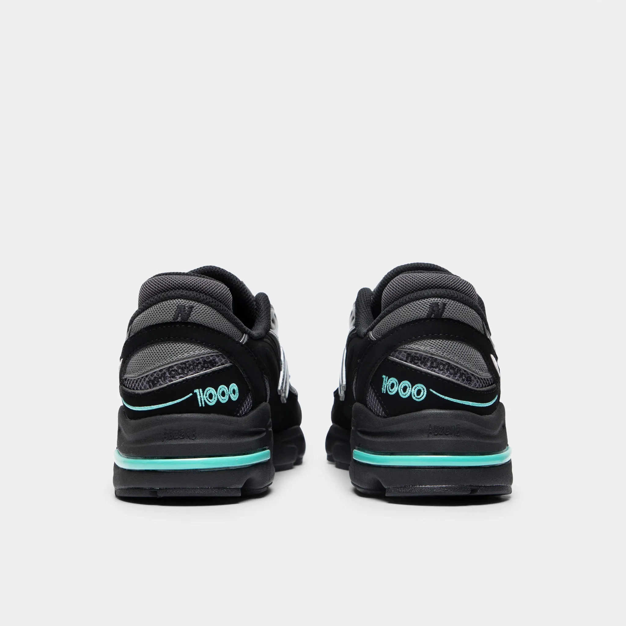 New Balance M1000 Black / Teal Season Ease