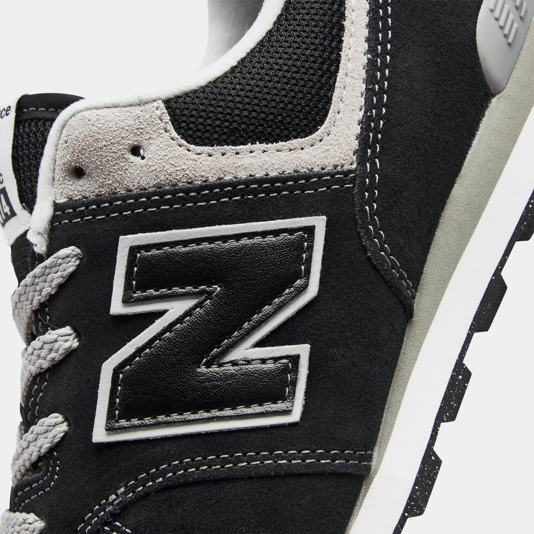 Road grip New Balance GC574EVB Black / White
