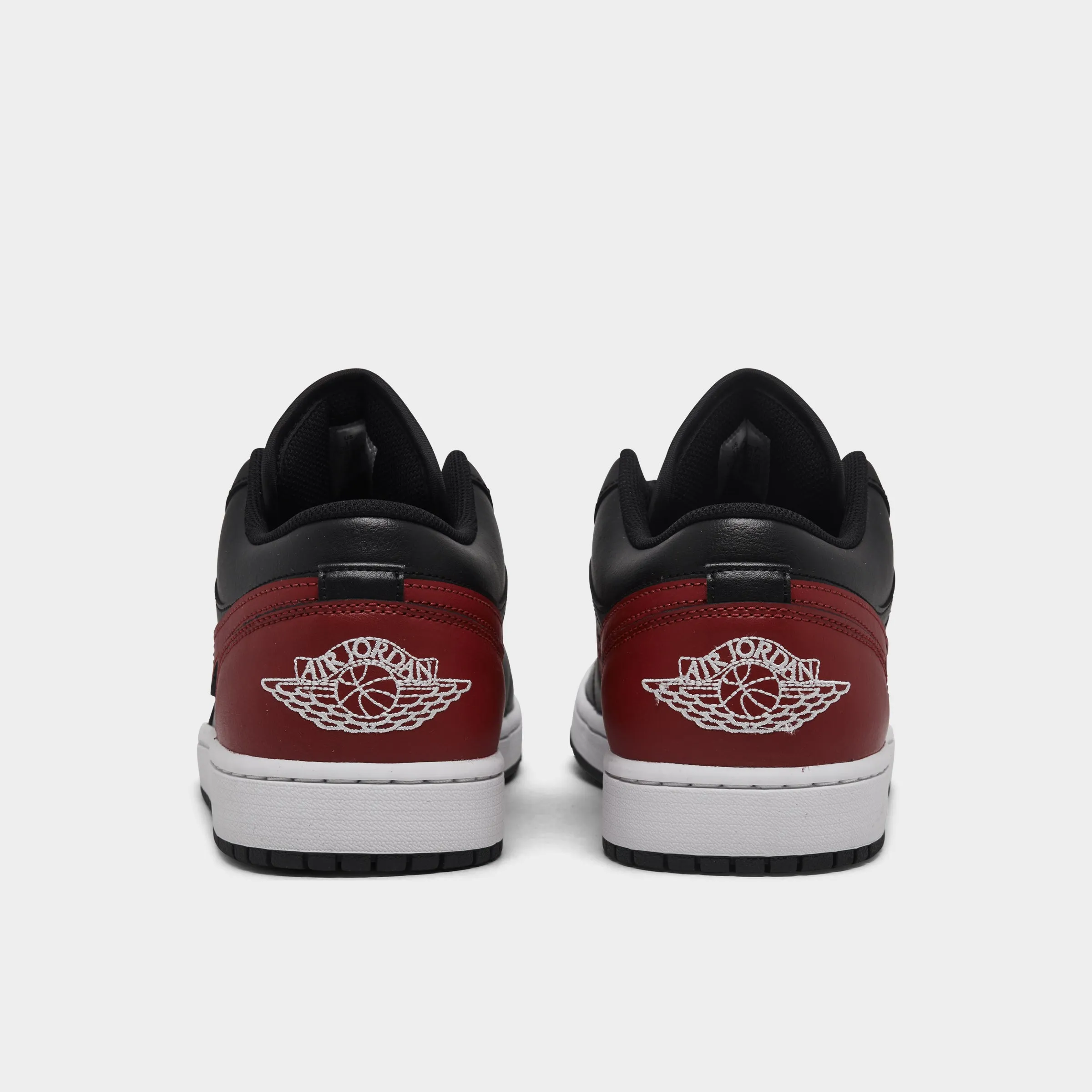Jordan 1 Low Black / Varsity Red - Summit White Soft Pressure Rubber Sole