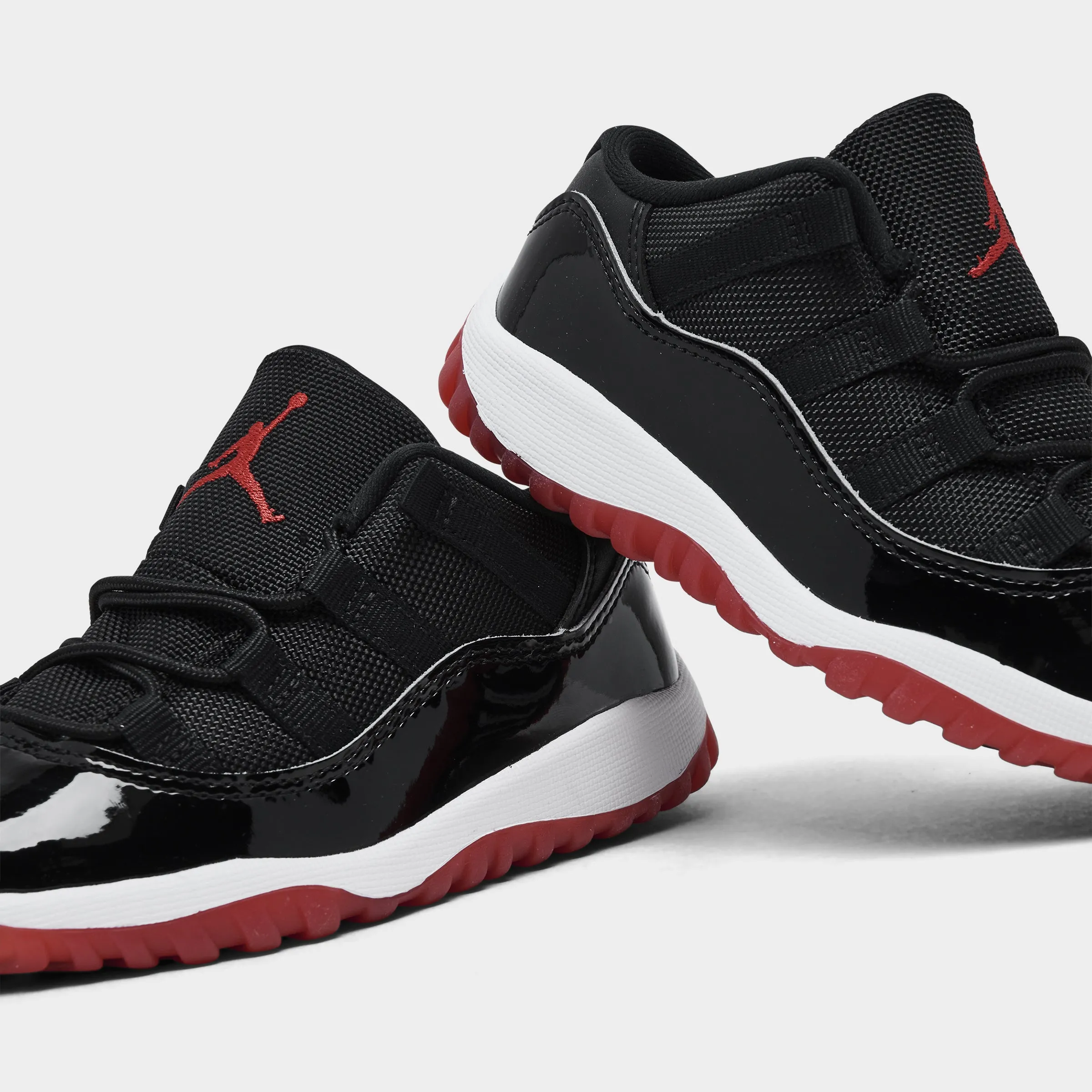 Jordan 11 Retro Low TD Black / Varsity Red - White All Around Event Step
