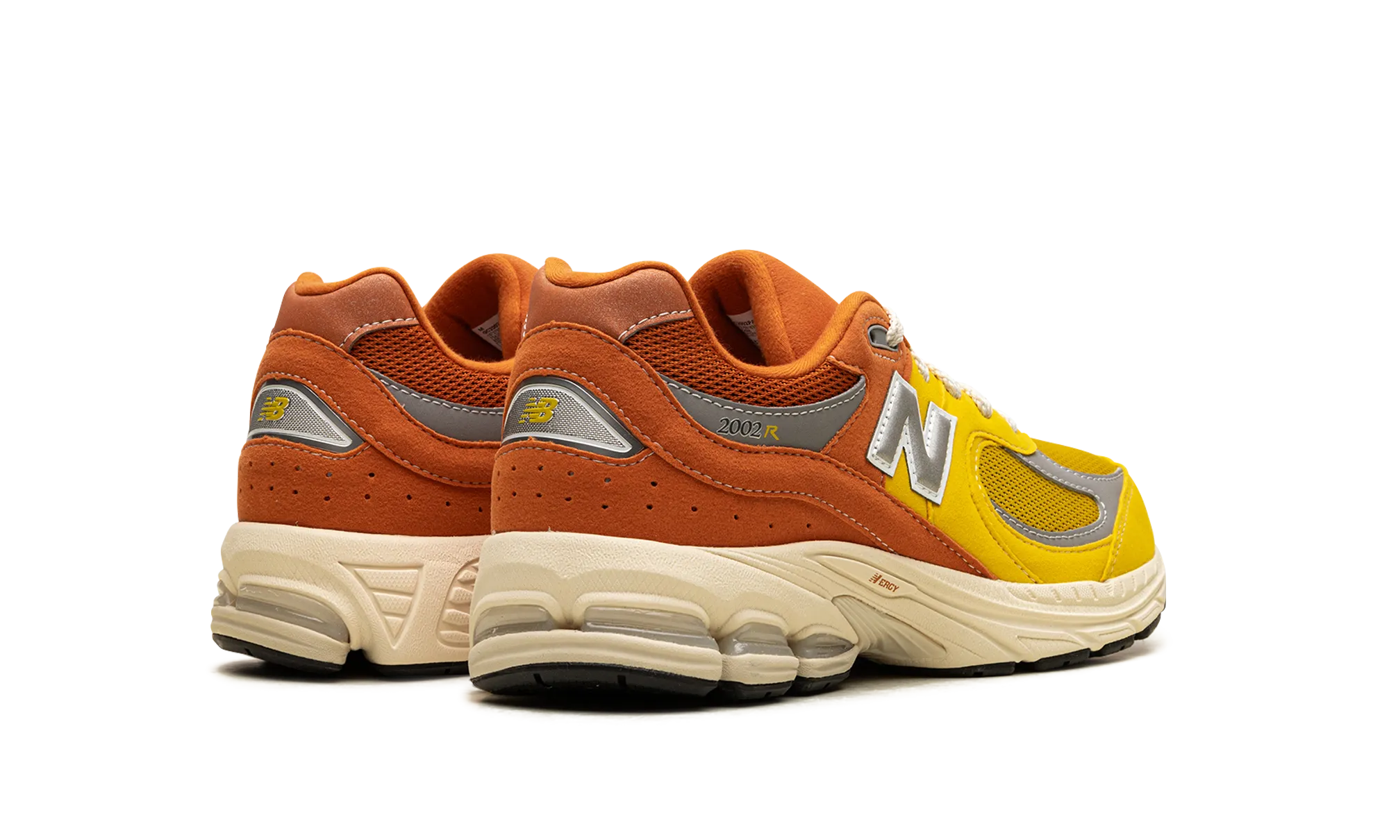 running with a flexible outsole running in regional tracks shoes 2002R GS "Ginger Lemon"
