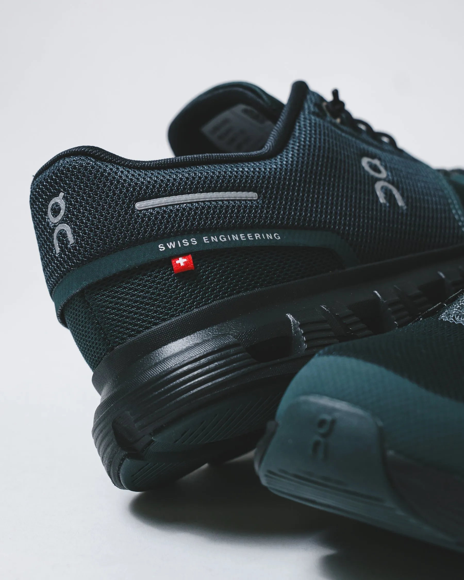 ON Men Cloud 6 Evergreen Black 3MF10070214 running in a concrete bridge area shoes cold - climate running shoes