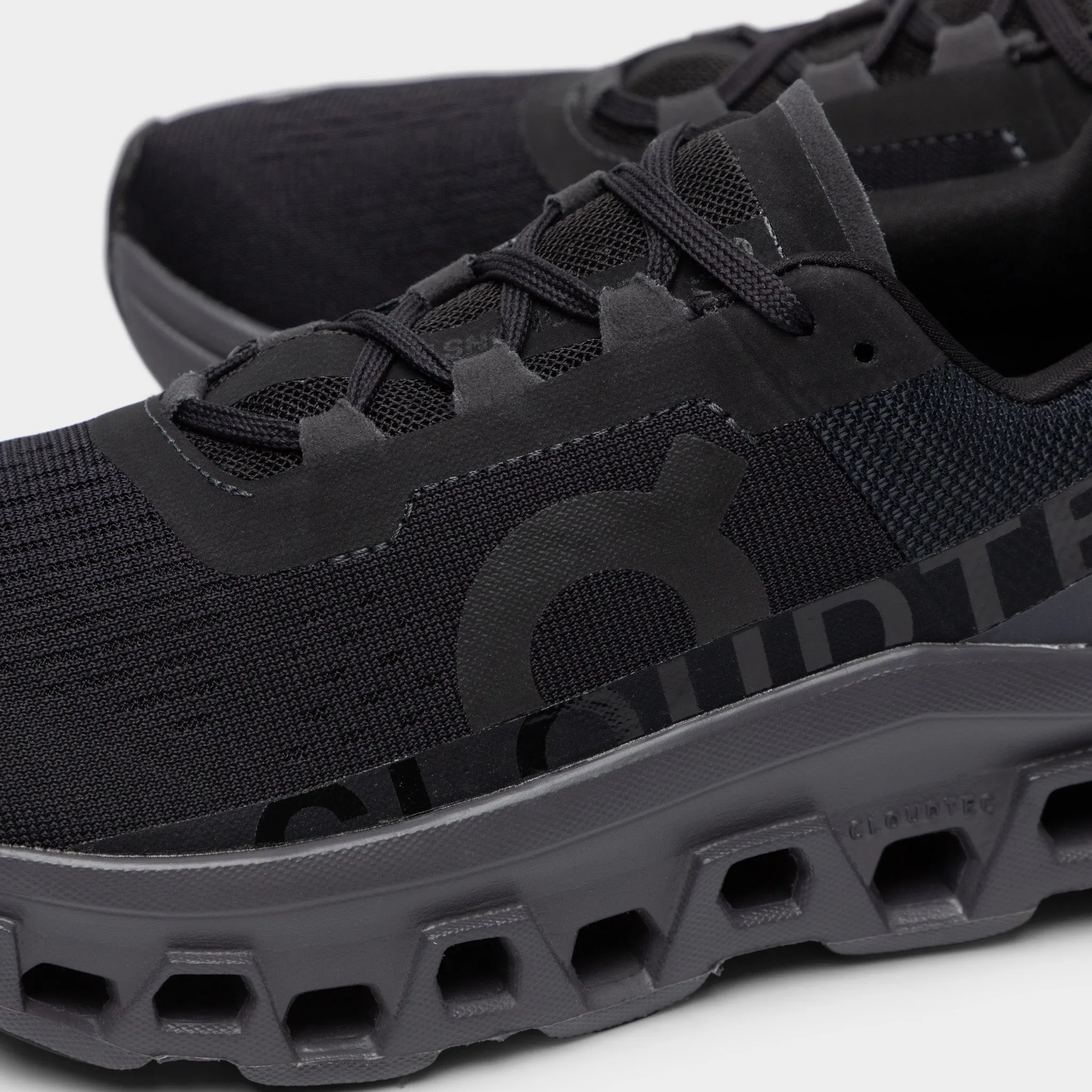 On Women's Cloudmonster Black / Magnet Lunch Jog Stable Motion