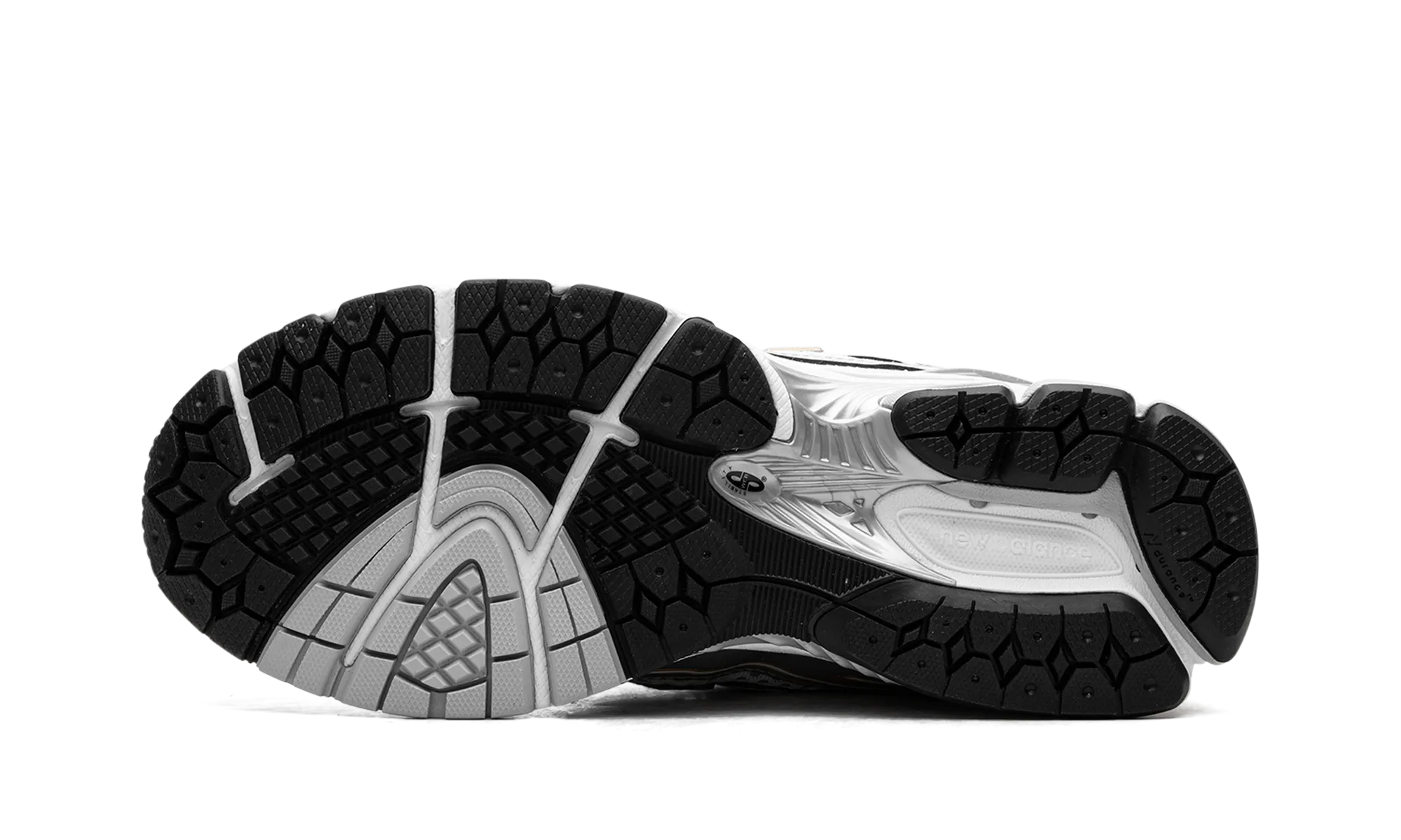 1906R "White Rain Cloud Silver Metallic" running in banked tracks shoes