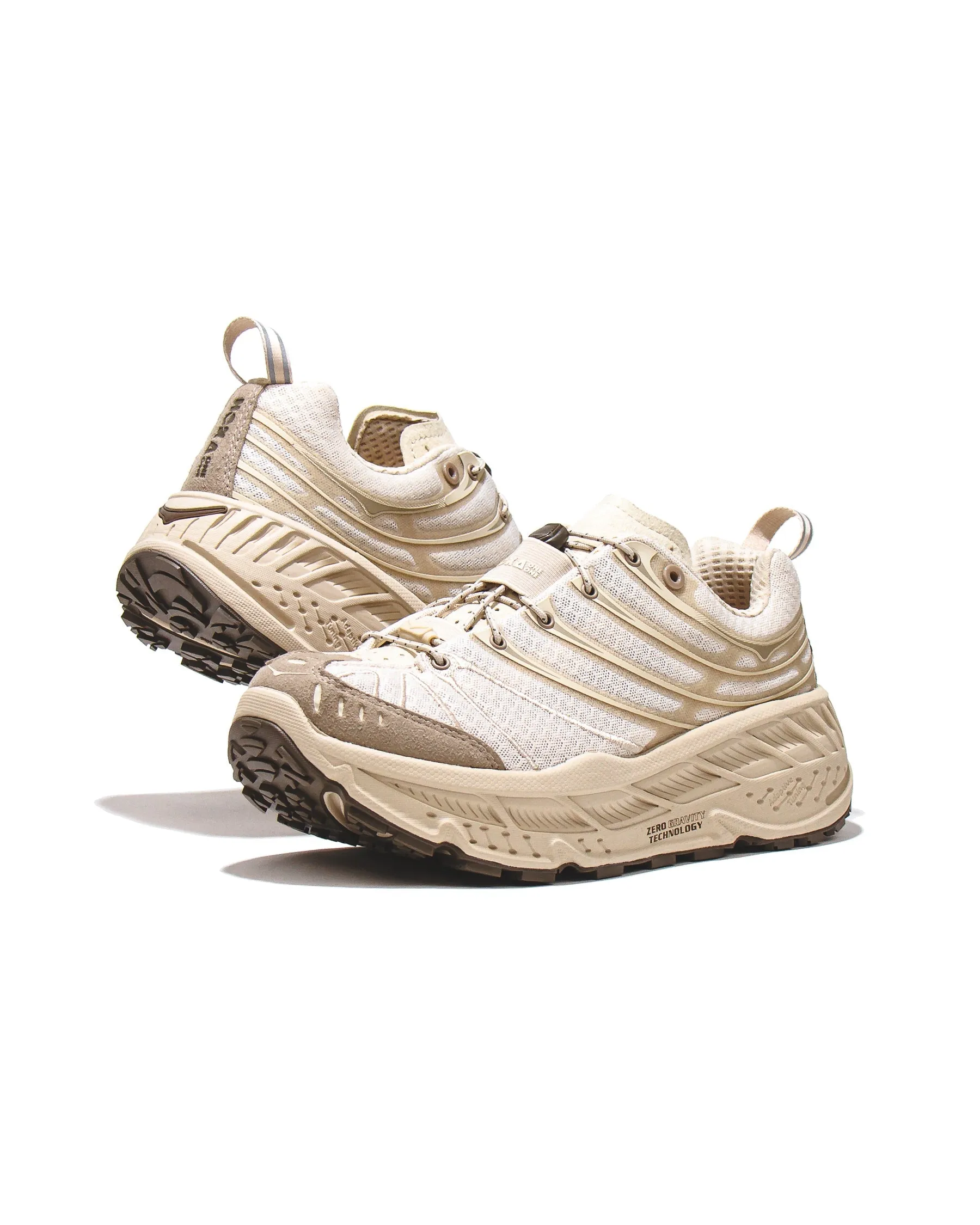 Hoka One One Men Stinson EVO OG Oat 1155350-OTTM running in a floodplain area shoes